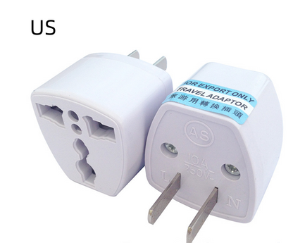 White travel adapter with a blue label on a white background
