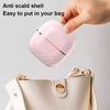 Pink anti-scald shell being placed into a beige handbag with text indicating ease of use.