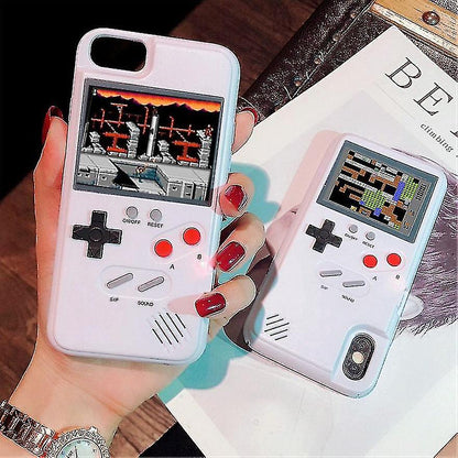 Phone cases designed like classic game controllers held by a person with red nail polish.