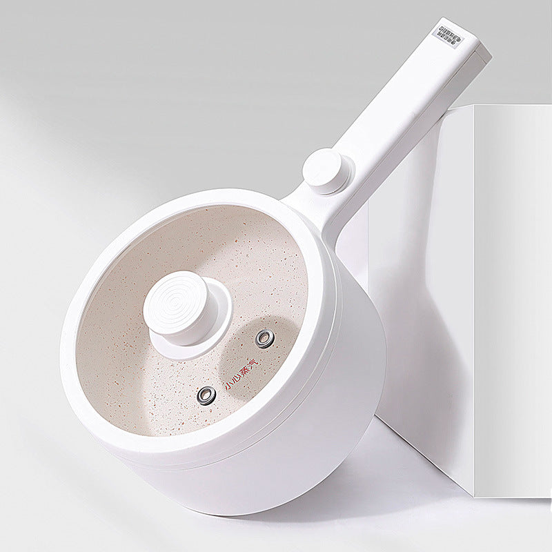 White kitchen tool with beige interior on a light gray background