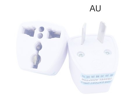 A white universal travel adapter plug shown from two angles on a plain white background, with the text 'AU' printed above it.